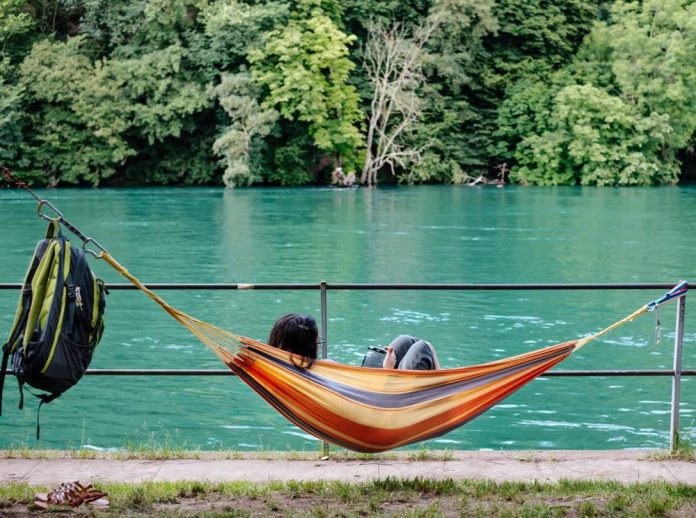 Ebook tools from eBooks.com let you focus on the main game Publisher lying in hammock reading an ebook