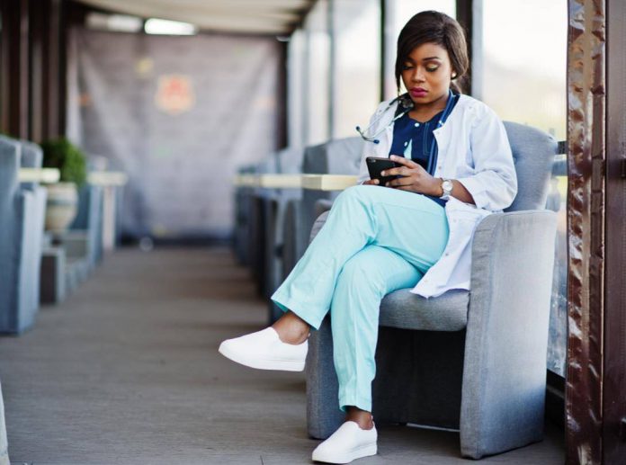 Healthcare worker reading an ebook
